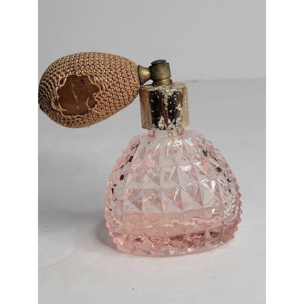Pink glass textured perfume bottle.